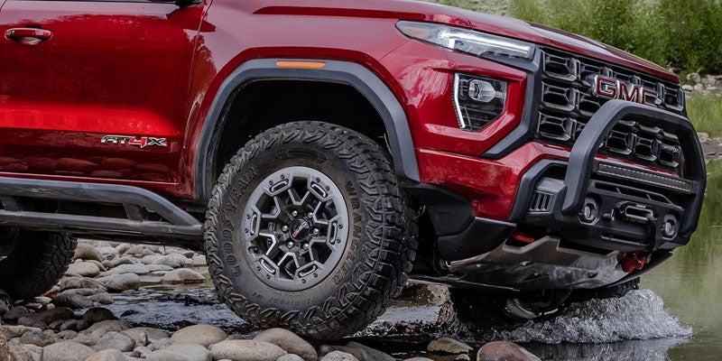 2026 GMC Canyon AT4X front exterior on rocky terrain